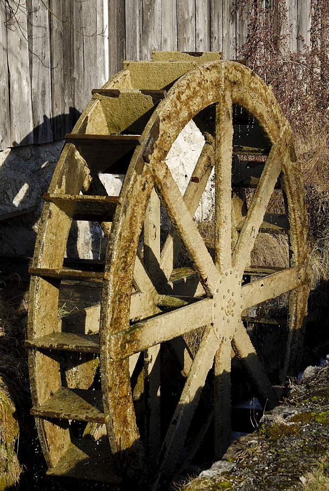 Wooden mill wheel at an old sawmill in Nussdorf, Bavaria, Germany, Europe