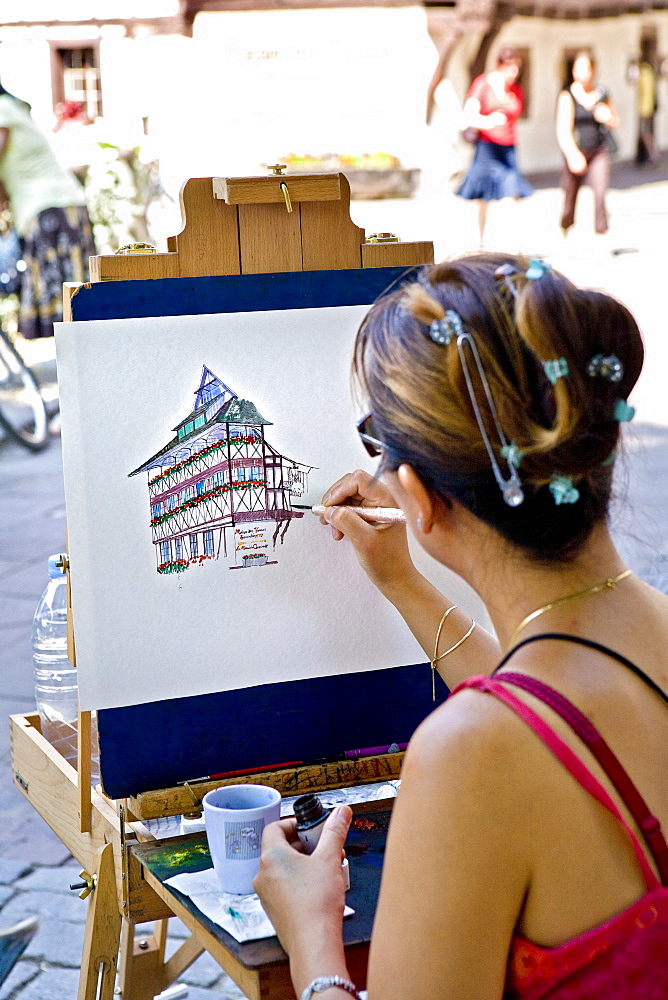 Painter in Petite France, Strasbourg, Alsace, France, Europe