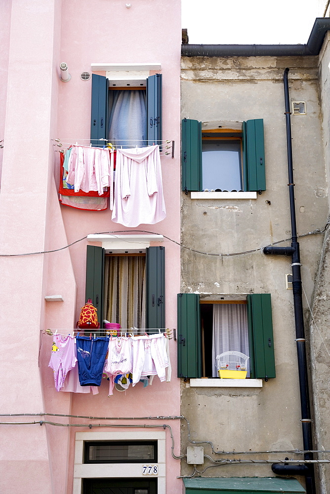 Washing lines on a house wall, Chioggia, Venetian Lagoon, Italy, Europe