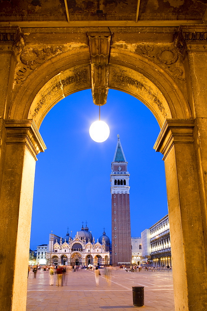 View through arcades towards Basilica di San Marco, St. Mark's Basilica and Campanile, evening mood, Venezia, Venice, Italy, Europe