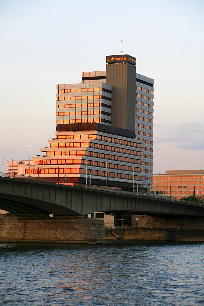 Lufthansa high-rise building and Deutzer Bruecke, Deutzer Bridge illuminated by the sunset at the Rhine River, Cologne, North Rhine-Westphalia, Germany, Europe