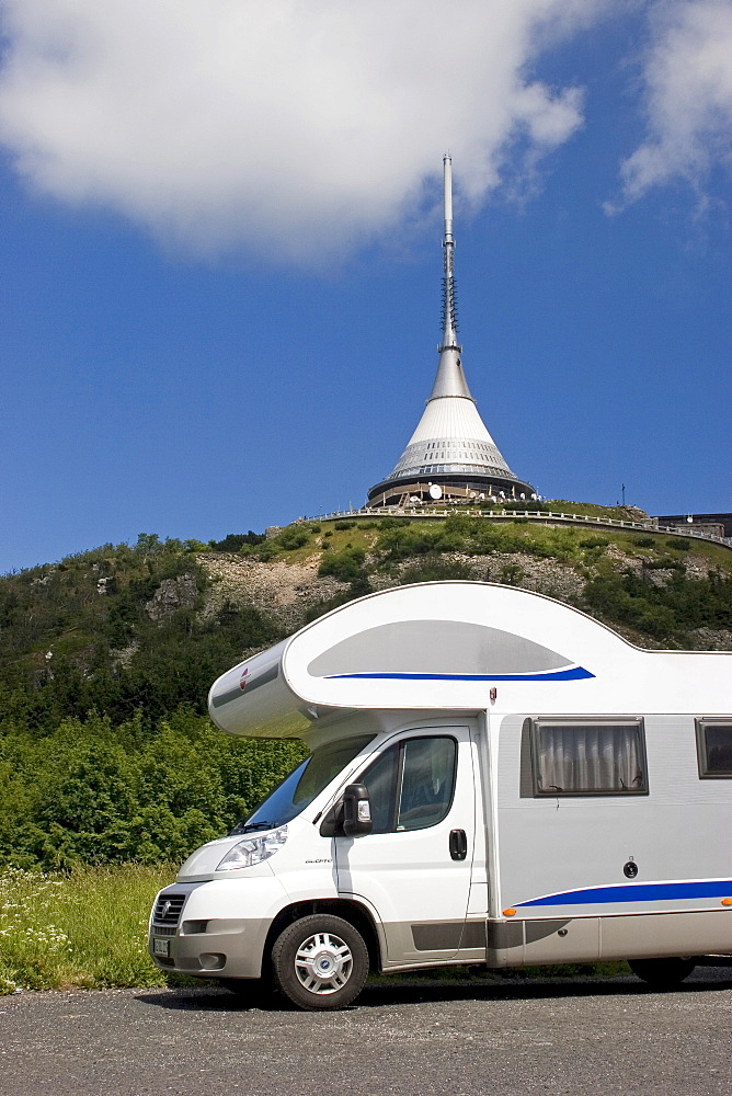 Motorhome in front of Jested Mountain, 1012 m, television tower and Hotel built by the architect Hubacek, Liberec, Czech Republic