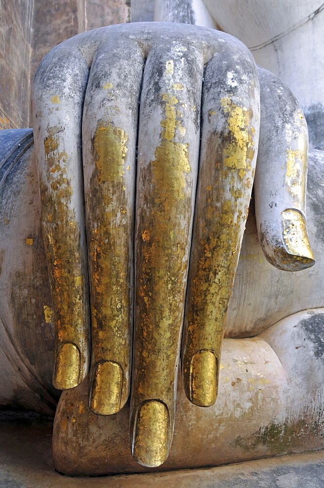 Gold leaf hand of a Buddha statue, Wat Si Chum, Sukhothai Historical Park, Sukhothai, Thailand, Southeast Asia, Asia