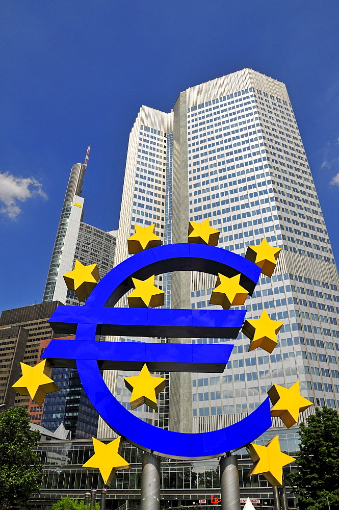 Euro symbol surrounded by stars, in front of multistory buildings, Eurotower of the European Central Bank, Frankfurt, Hesse, Germany