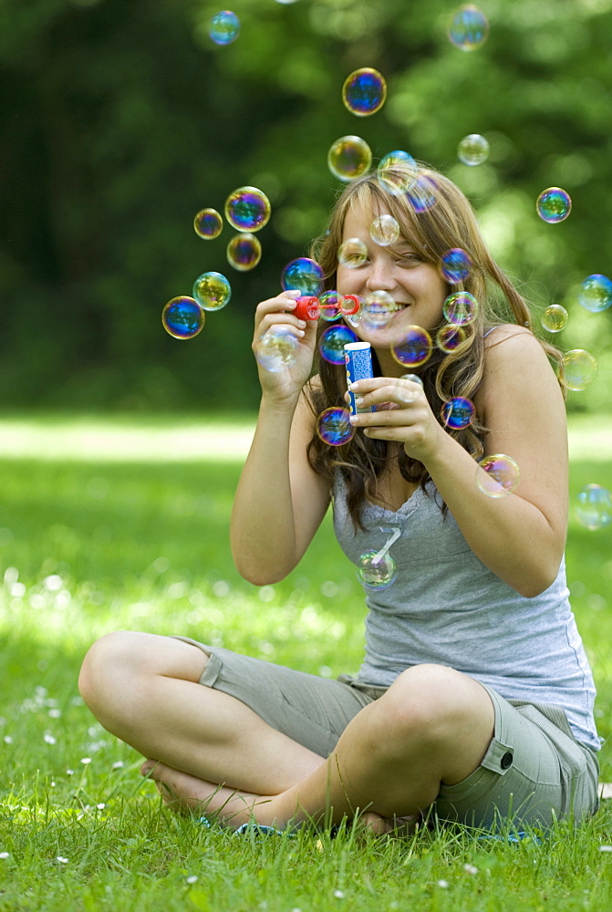 A woman with soap bubbles