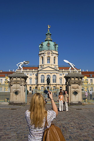 Tourist takes a picture of castle Charlottenburg, south portal, Charlottenburg-Wilmersdorf, Berlin, Germany