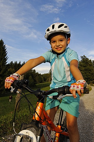 Girl, 7, riding a mountain bike