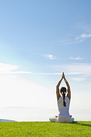 Young woman practising Hatha yoga outdoors, showing the pose merudandasana, sitting mountain pose, Nove Mesto, Okres Teplice, Czech Republic, Europe