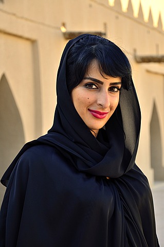 Native woman with veil in the Al-Jahili Fort of Al Ain, Unesco World Heritage Site, Abu Dhabi, United Arab Emirates, Arabian Peninsula, Orient, Asia