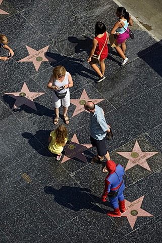 Tourists taking photographs in front of terrazzo star for Britney Spears, Walk of Fame, Hollywood Boulevard, Hollywood, Los Angeles, California, United States of America, USA, PublicGround