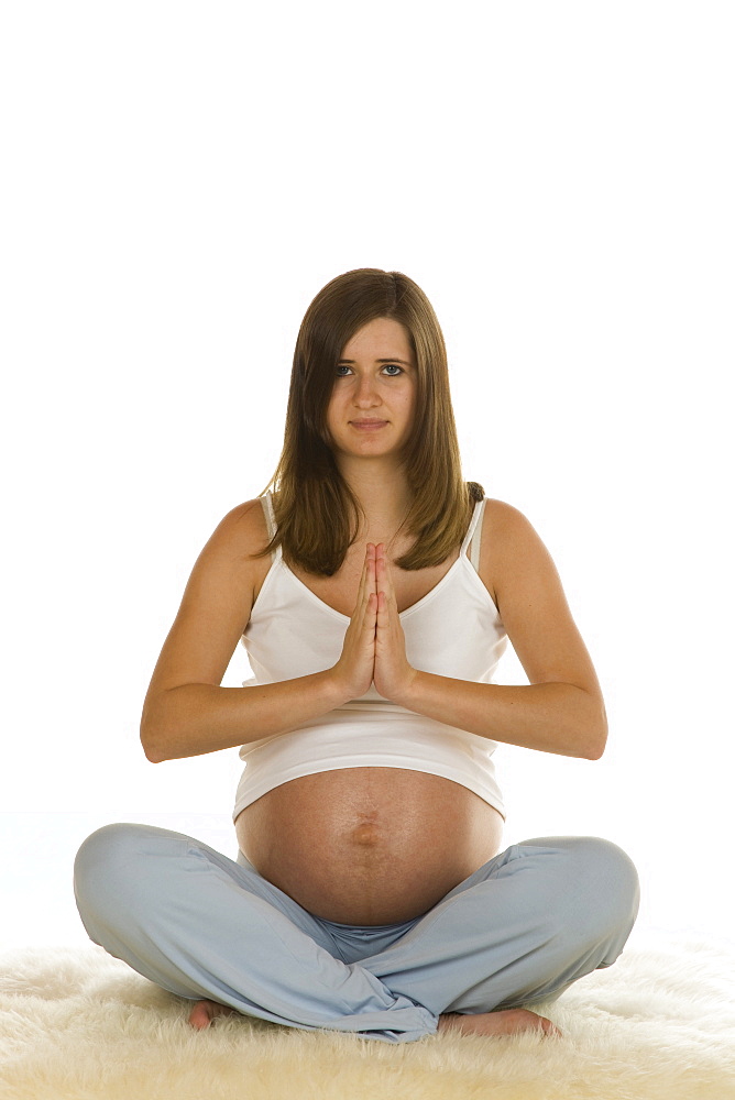 Pregnant woman practising yoga