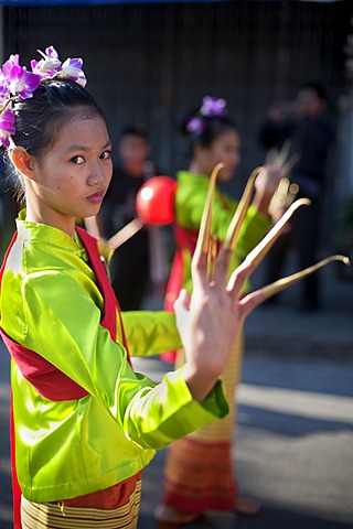 Young female dancer at a street parade in Chiang Mai, Thailand, Asia