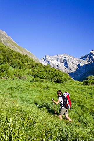 Mountain climber passing through Pfitschertal Valley while ascending Hochfeiler Mountain, Alto Adige, Italy, Europe