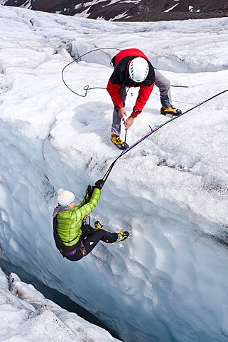 Mountaineers climbing on Zufallferner Glacier, during a crevasse rescue, South Tyrol, Italy