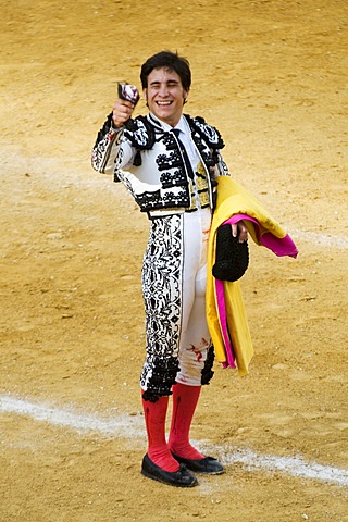 Torero presenting cut off ears of conquered bull, Benidorm, Spain, Europe