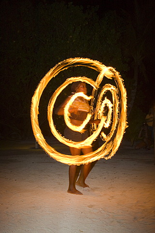 Fire artist performing at an evening event held for tourists in Honduras, Central America