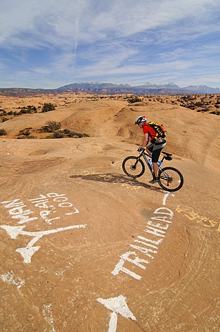 Mountain biker on Slickrock Trail, Moab, Utah, USA