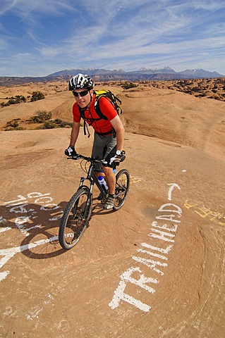 Mountain biker on Slickrock Trail, Moab, Utah, USA