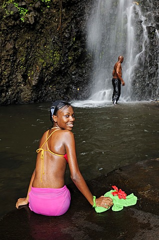 Woman and man at the Trinity Falls, Saint Vincent, Lesser Antilles, Caribbean