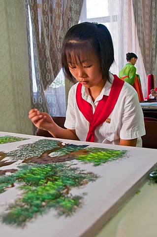 Girl practicing calligraphy, one of the selected children in the Children's Palace, Pyongyang, North Korea, Asia