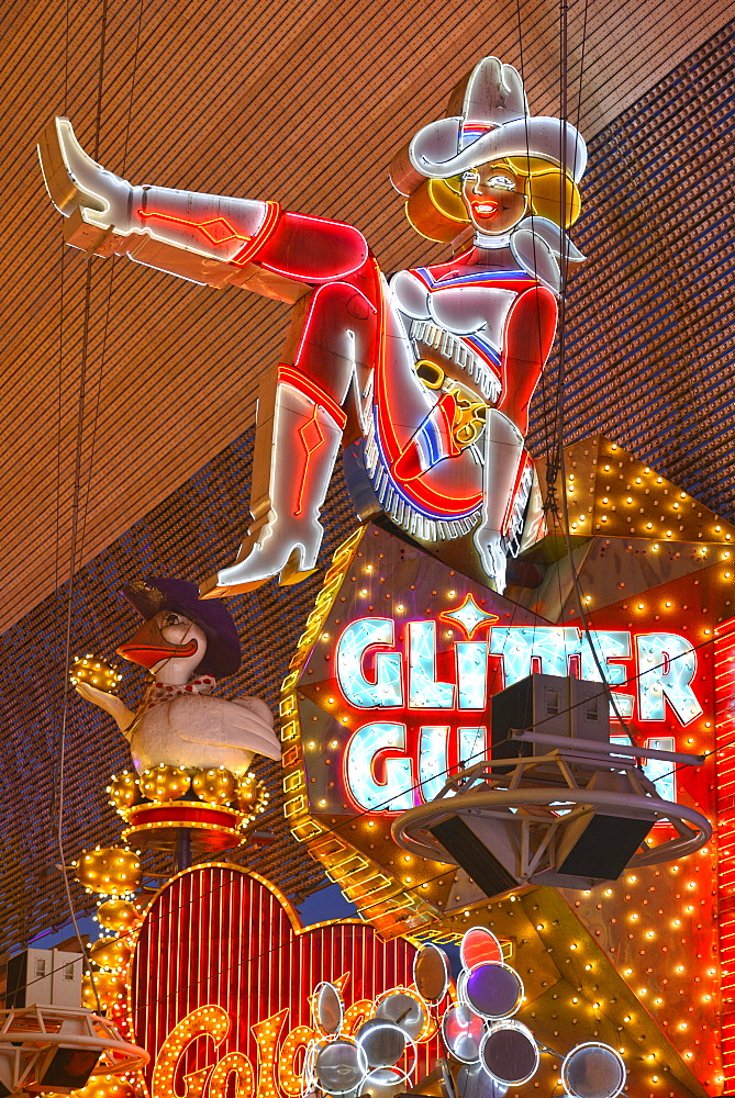 Vicky, the famous cowgirl figure from the neon sign of the Glitter Gulch Casino Hotel, Fremont Street Experience in old Las Vegas, Downtown Las Vegas, Nevada, United States of America, USA, PublicGround