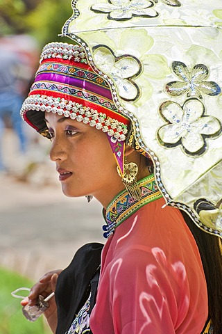 Young Chinese woman in traditional dress of the Yi minority, South China, Asia