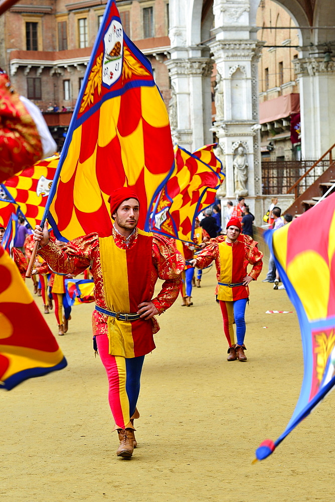 Flag-waver the Contrada of the Snail, Contrada della Chiocciola, at the Palio di Siena, Piazza del Campo, Siena, Tuscany, Italy, Europe