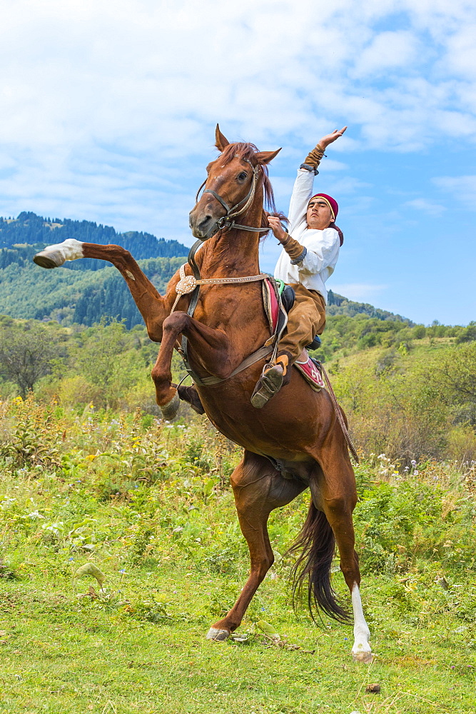 Man on an upright horse, Kazakh ethnographic village aul Gunny, Talgar, Almaty, Kazakhstan, Asia