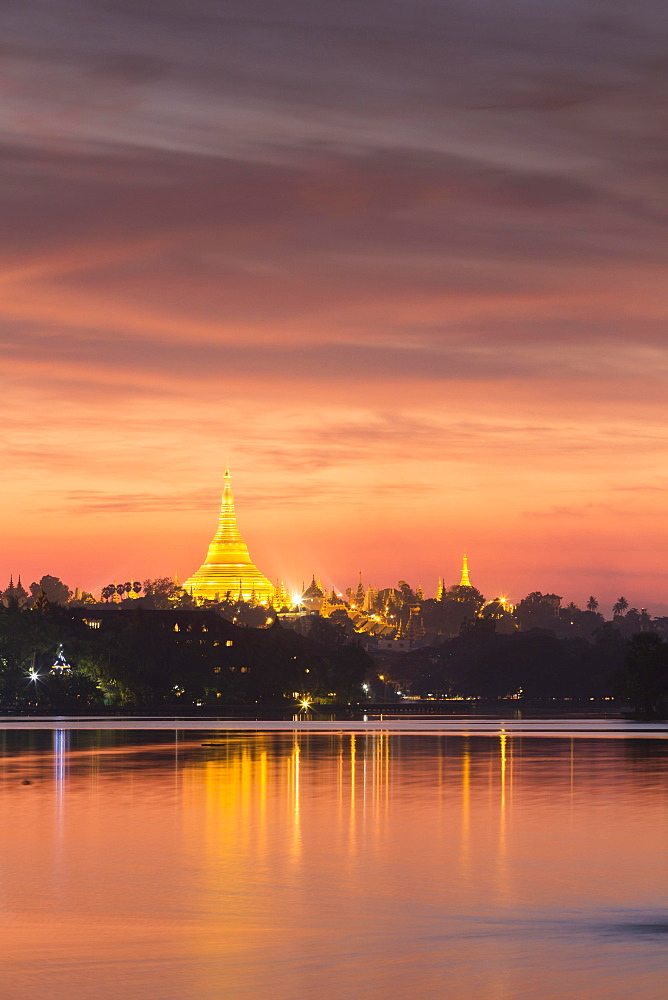 Illuminated Shwedagon Pagoda at sunset, The Great Dagon Pagoda, seen from Kandawgyi Lake, Yangon, Myanmar, Asia