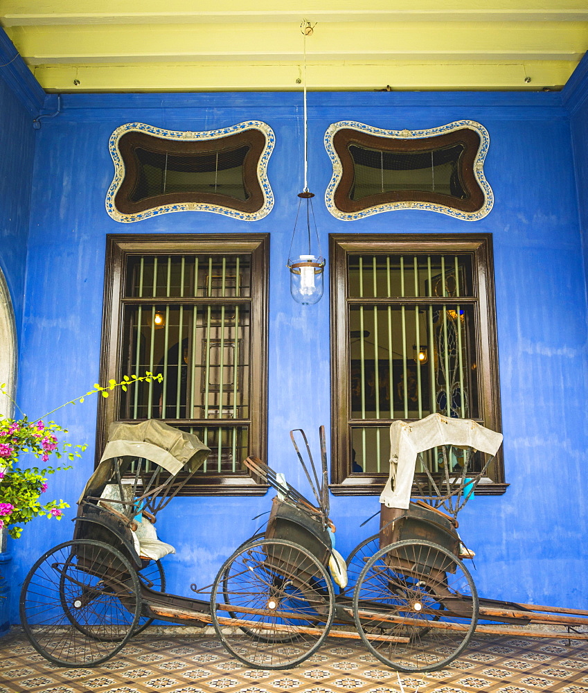 Old rickshaws on the blue wall, Cheong Fatt Tze Mansion, blue villa, Leith Street in George Town, Penang, Malaysia, Asia