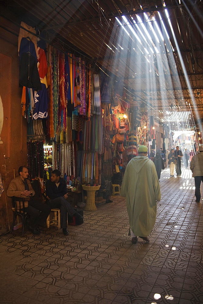 Sun rays filtering through beams at the souks of Marrakesh, Morocco, Africa