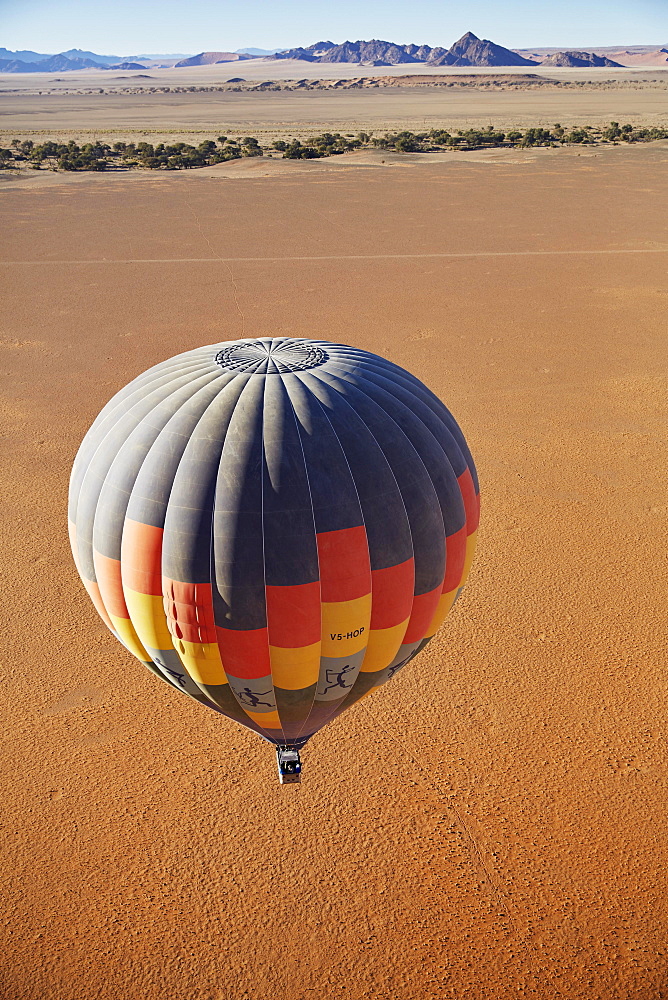 Hot air balloon, behind the Naukluft Mountains, Namib-Naukluft National Park, Namib Desert, Namibia, Africa