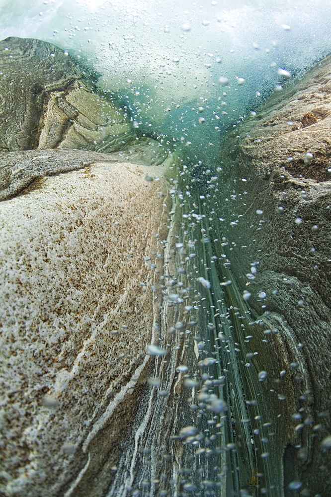 A waterfall seen from underwater, Verzasca River, Lavertezzo, Valle Verzasca valley, Canton of Ticino, Switzerland, Europe