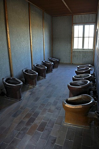 Toilets in the barracks at the concentration camp grounds, Dachau near Munich, Bavaria, Germany, Europe