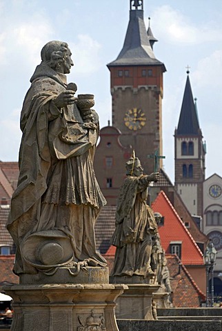 Statues on the Alte Mainbruecke, Old Main Bridge with the towers of downtown Wuerzburg at back, Lower Franconia, Bavaria, Germany, Europe