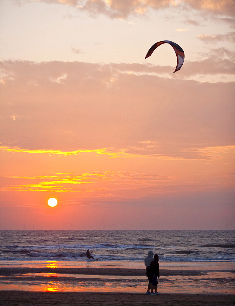 Kite surfer on the beach of Egmond aan Zee at sunset, Netherlands, Europe