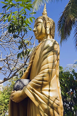 Buddha statue holding a begging bowl, Luang Prabang, UNESCO World Heritage Site, Laos, Indochina, Asia