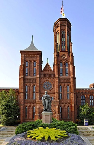 Statue of scientist Joseph Henry in front of the Smithsonian Institution Building, admin building and museum, known as "the Castle", National Mall, Washington DC, District of Columbia, United States of America, USA, PublicGround