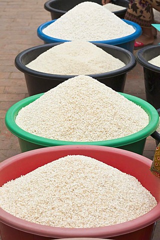 Tubs of rice for sale at the morning market in Luang Prabang, Laos, Southeast Asia.