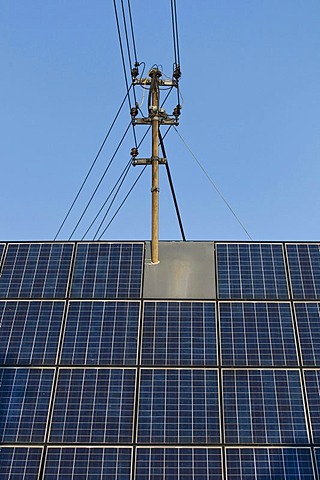 Roof with solar panels and a power pole, consumers produce their own electricity, energy turnaround, PublicGround