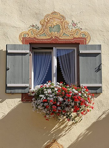 Window with Lueftlmalerei, frescoes on facade, and geraniums, Neubeuern, Inn Valley, Chiemgau region, Upper Bavaria, Bavaria, Germany, Europe