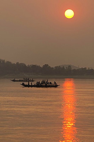 Boats at sunset on the Brahmaputra river near Guwahati, Assam, India, Asia