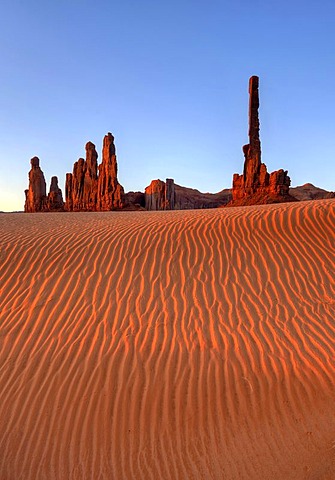 Sand dunes in front of Totem Pole and Yei Bi Chei rock formation, Monument Valley, Navajo Tribal Park, Navajo Nation Reservation, Arizona, Utah, United States of America, USA