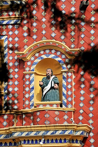 Statue of an evangelist with indigenous features in the facade of the church of Iglesia Santa Maria de Tonantzintla, San Pedro Cholula, Puebla, Mexico, Latin America, North America