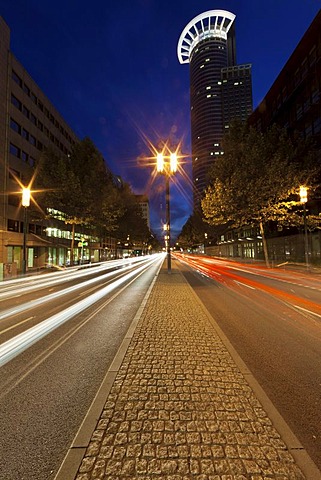 Rush-hour traffic at dusk, Mainzer Landstrasse street, Westendstrasse 1 building at the back, also known as Westend Tower or Kronenhochhaus, DZ Bank headquarters, Frankfurt am Main, Hesse, Germany, Europe, PublicGround