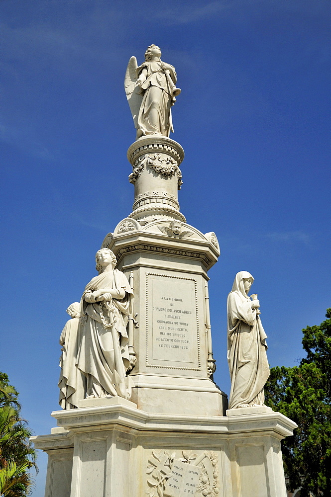 Statue of an angel on one of the monumental tombs, Colon Cemetery, Cementerio Cristobal Colon, named after Christopher Columbus, Havana, Cuba, Caribbean