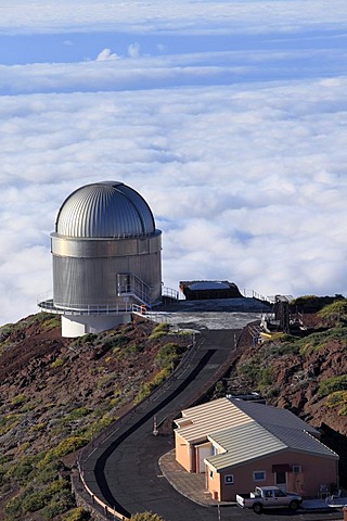 View over the cloud cover with Nordic Optical Telescope observatory, astronomical telescope, Roque de los Muchachos Observatory or Observatorio del Roque de los Muchachos or ORM, Mt. Roque de los Muchachos, volcanic island of La Palma, La Isla Verde, La I