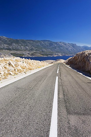 Road through karst landscape in Zigljen, Pag island, Dalmatia, Croatia, Europe