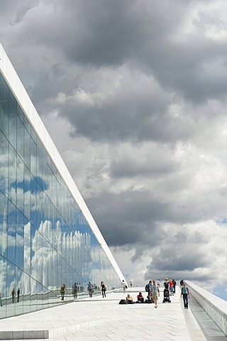 Modern architecture, inclined plane, dark clouds reflected in the glass, New Opera House, Operaen, Oslo, Norway, Scandinavia, Northern Europe, Europe