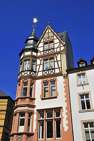 Half-timbered house with weathervane on the marketplace in Bernkastel-Kues, Rhineland-Palatinate, Germany, Europe